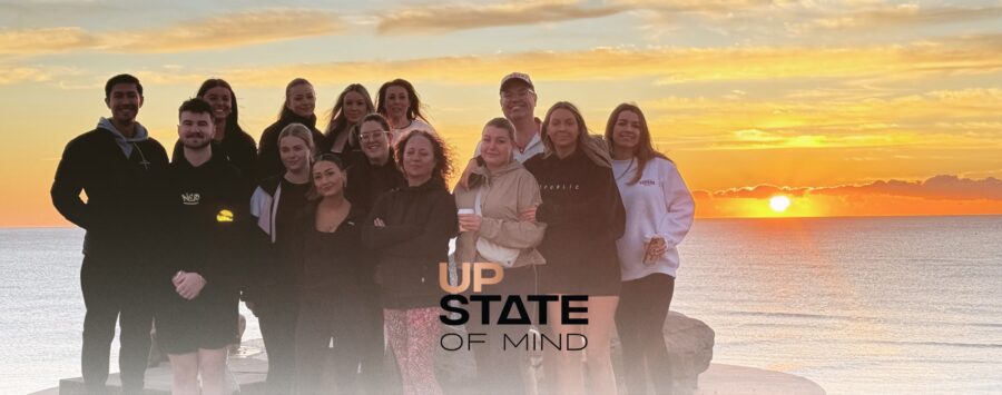 Upstate Property Management team at the 2025 Upstate of Mind conference, focused on wellbeing, leadership, and growth.