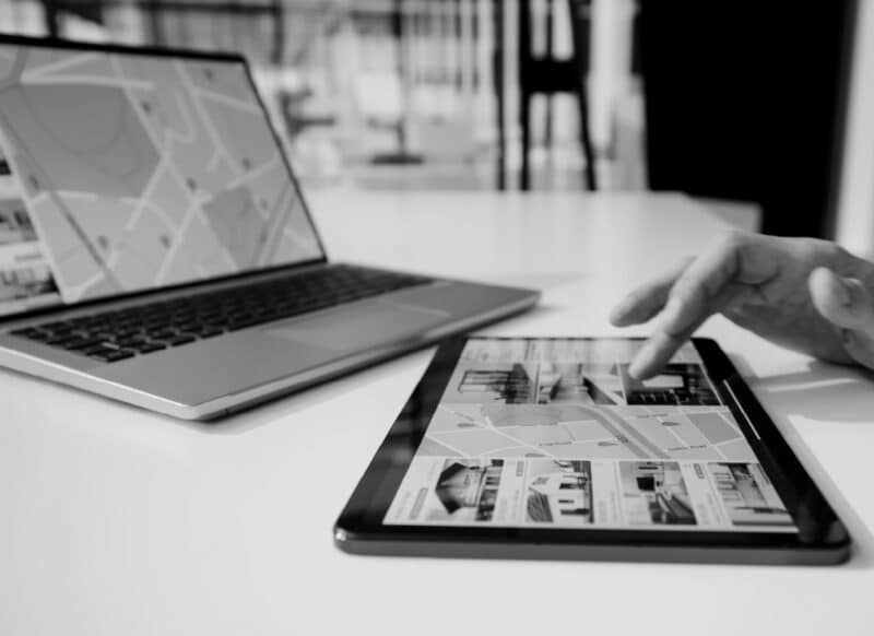 Digital tools displaying commercial property listings and mapping used in sales strategy.