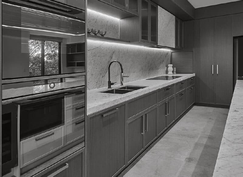 Residential leasing specialists reviewing lease documentation together at a table.