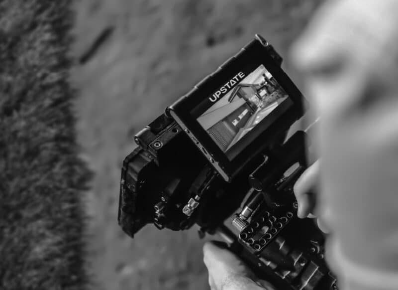 Professional camera capturing residential property marketing content for leasing campaigns.