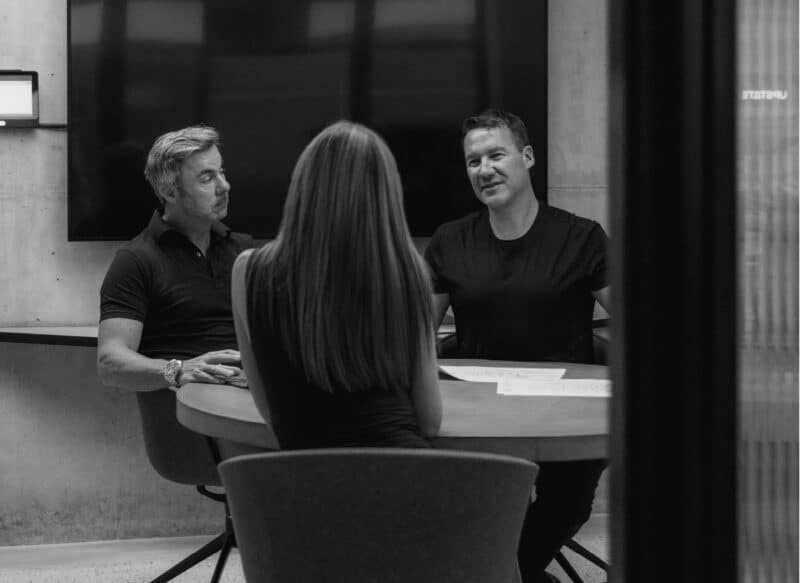 Residential property owners meeting with advisors to discuss sales strategy